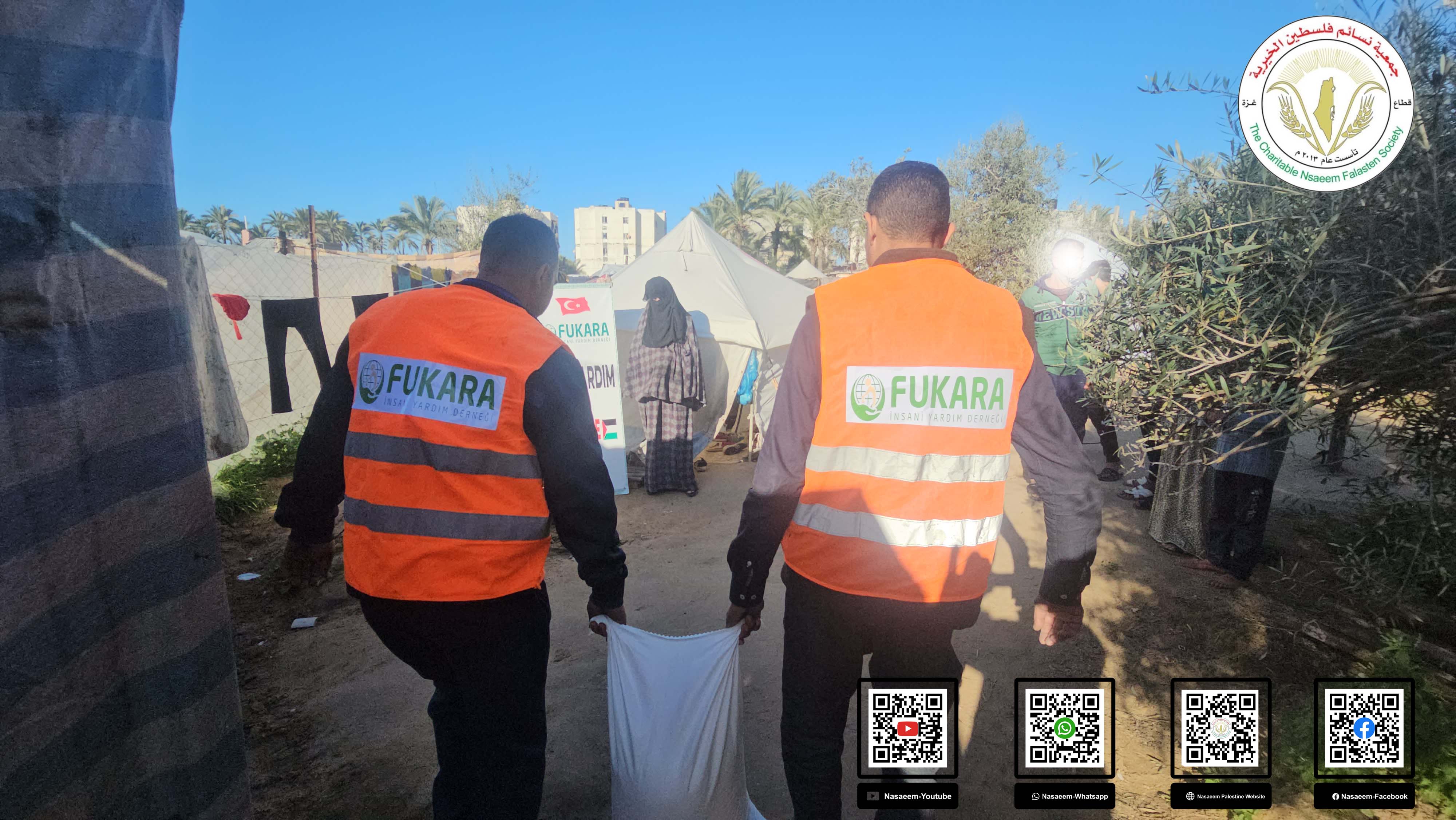 مشروع توزيع الطحين على الأسر النازحة بغزة
